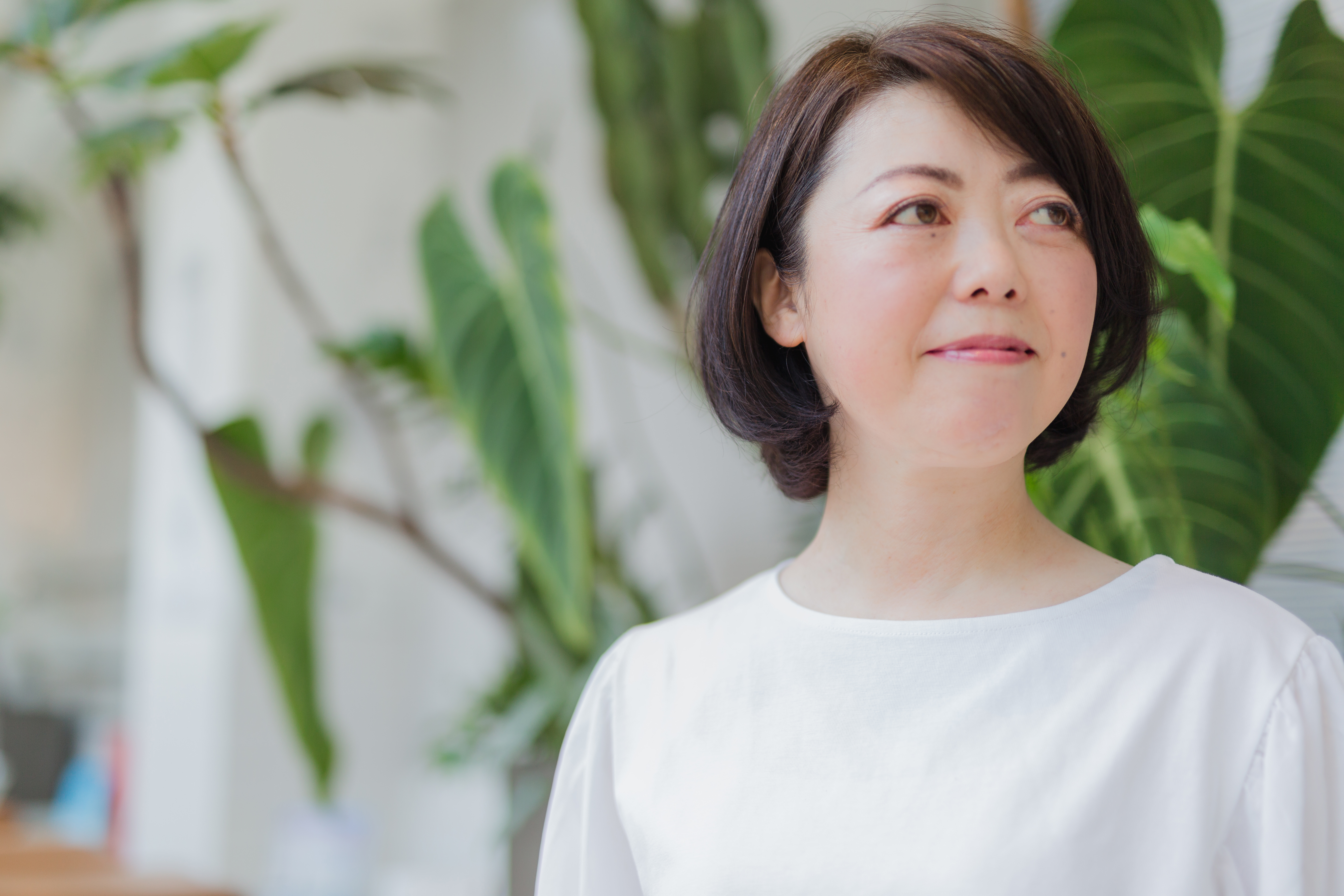 市政報告会で話す川上ともみ